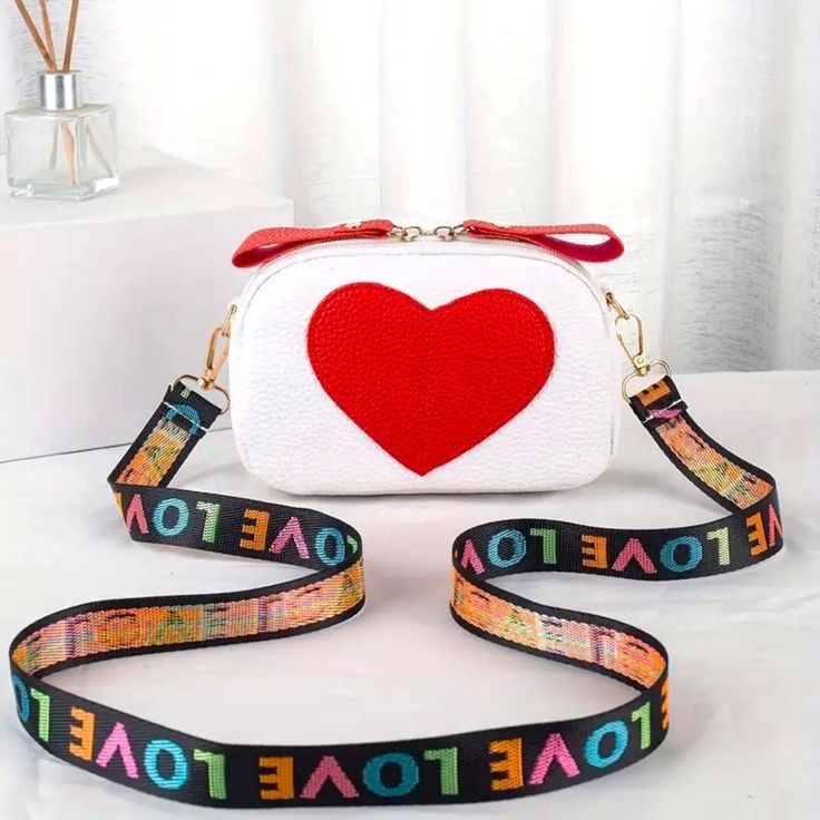 Trendy Heart Bag Shoulder Strap Crossbody Purse Textured Zipper Love Red White Brand New In Package No Price Tags Attached Super Cute Crossbody Shoulder Bag Purse White With Red Heart & Detachable Colorful Rainbow Love Print Strap Faux Vegan Patent Leather (6j168) Tags Home, Country ,Collectable, Vintage, Figurine ,Office, Boho, Hippie, Stylish, Gift, Fashion, Surfer, Vacation, Beach, Unisex, Vegan, Minimalist, Western, Southwest, Native American, Mid Century, Retro, Chic,, Victoria's Secret, Se White Heart-shaped Shoulder Bag For Valentine's Day, White Crossbody Bag For Valentine's Day, White Shoulder Bag For Valentine's Day, Trendy White Heart-shaped Shoulder Bag, White Rectangular Bag With Heart Print, White Heart Print Bag For Gifts, White Heart Print Bag As A Gift, Casual White Heart-shaped Bag, White Heart-shaped Shoulder Bag For Daily Use