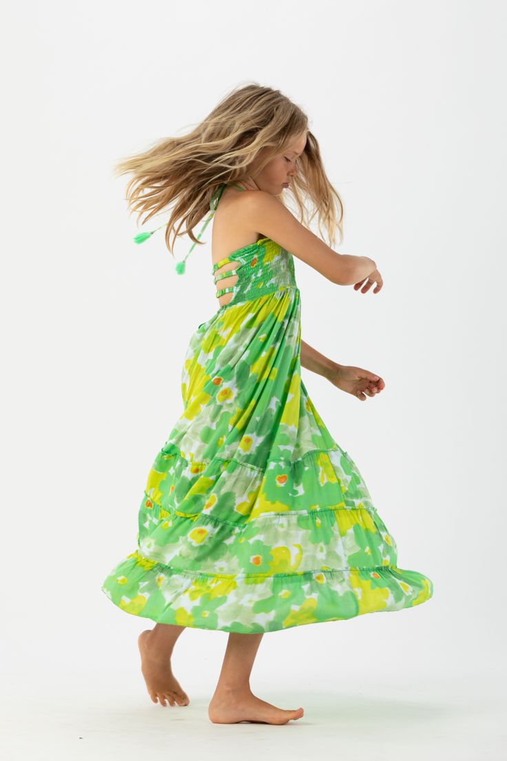 Keep your little ones event-ready with a touch of fun in the Tiare Hawaii Kids Bellini Dress. Finding a new way to Match with Mom, one bold dress at a time, the floor-length flowing design will be a new family favorite. Featuring a self tie halter with a caged back design, the Kids Bellini Dress is a sunny day staple that will always make them smile. Details: 100% Rayon Hand wash cold & lay flat to dry Features: Unlined, Smocked bodice, Self-tie halter straps for a customizable fit, Tassel tie d Hawaii Kids, Bold Dress, Spring Getaway, Bold Dresses, Jumpsuit For Kids, With Mom, New Family, Kids Swimming, Bellini