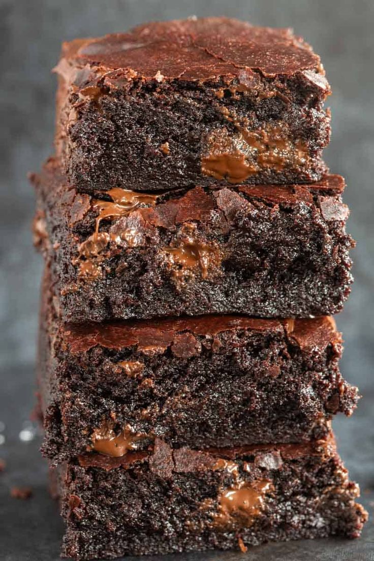 three chocolate brownies stacked on top of each other