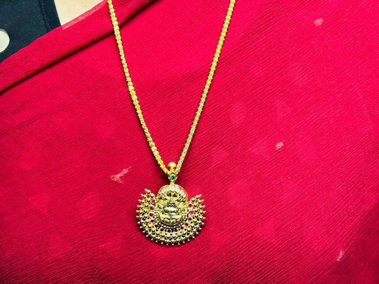 22 karat gold 'lakshmi nagaram' pendant with color stones
  
  note: this item can also be used as a hair clip, it has a clip/pin on the back side.
 - 235-GP2257 - in 10.550 Grams for USD $1,204.60 USD. 
Made in India by Totaram Jewelers Online this product is in Gold - 22 Karat BIS Hallmark 916 Gold  & is an excellent gift for Adult - Women. Ships fully insured with secured guaranteed delivery for free with your order over $250 from New Jersey USA & comes with 30 days exchange Yellow Gold Kundan Necklace For Puja And Festivals, 22k Gold Temple Necklace, 22k Gold Kundan Pendant Necklace For Diwali, Yellow Gold Temple Necklace With Pallu As A Gift, Yellow Gold Round Pendant Temple Necklace, 22k Yellow Gold Temple Necklace, 22k Gold Kundan Pendant Necklace In Yellow Gold, Yellow Gold Kundan Necklace For Diwali Puja, Festival Temple Jewelry Necklace With Pendant