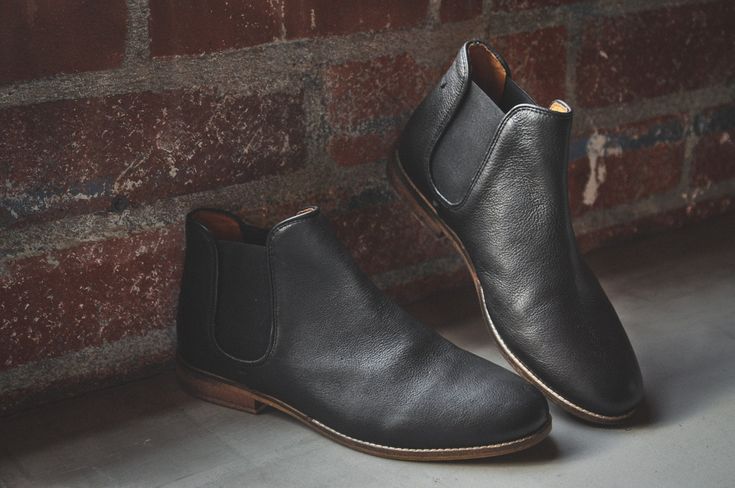 Our “Chelsea shoe boot”– Chelsea, because of its twin elastic panels; Shoe boot, because it’s lower than a boot, but taller than a shoe. Worn under longer pants it looks like a boot but has the relative comfort and ease of entry of a loafer. The Ronan (and its companion Gunnar) lean to the dress up side of the line. But both safely qualify under the “jeans” rule: [To wit: Any style must look great with a pair of jeans- in order to qualify for Hound&Hammer status]. We make the Ronan in a tumbled Casual Boots Womens, Chelsea Shoes, Mens Dress Boots, Black Shoes Men, Shoe Boot, Mens Boots Casual, Dressy Shoes, Low Boots, Leather Gloves