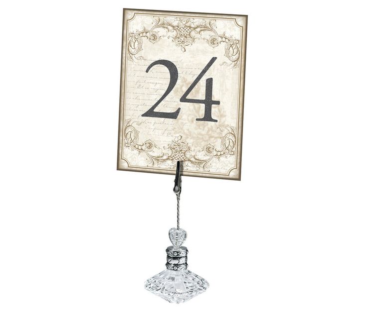 the number twenty four is placed on top of a glass stand with a metal base