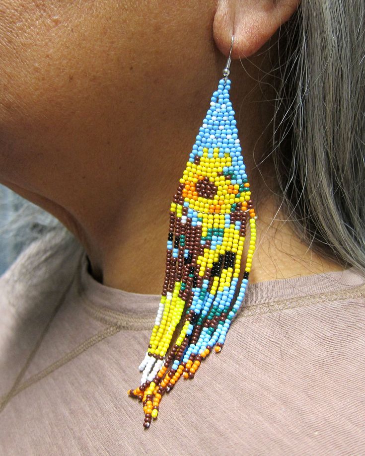 "Native American Style Desert Spring Blossoms great spring colors in a Seed Bead Earrings Handmade Ethnic Earrings Stainless Steel Ear Wires Free Shipping. Handmade beautiful brick weave Native American Ethnic Style earrings in great colors. Earrings hang about 6\" off the ear and are good for many face and neck sizes. Stainless steel ear wires for your safety. Free Shipping from Hawaii with Aloha!" Traditional Multicolor Flower Earrings With Dangling Beads, Unique Multicolor Flower-shaped Beaded Earrings, Beaded Multicolor Flower Earrings For Summer, Adjustable Multicolor Flower Earrings With Colorful Beads, Multicolor Beaded Flower Earrings For Summer, Multicolor Flower Beaded Earrings For Festival, Multicolor Floral Beaded Earrings For Festivals, Bohemian Flower Earrings With Dangling Beads, Yellow Bohemian Beaded Flower Earrings