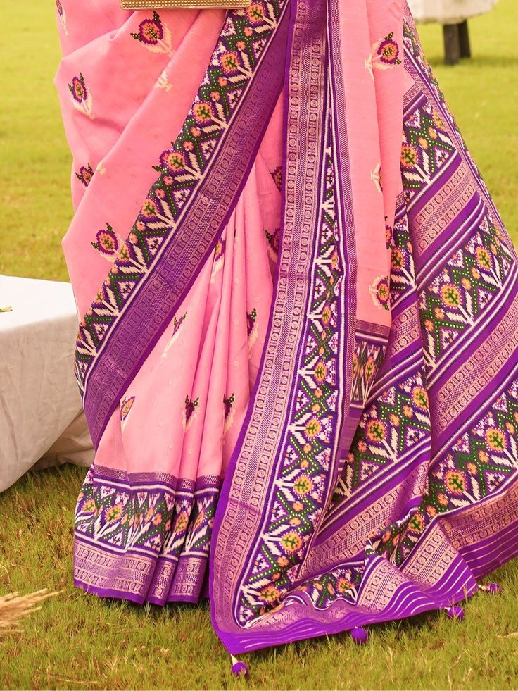 With its stunning pink color and exquisite patola printed work, this silk saree is truly a masterpiece. Made from high-quality silk material, this saree drapes beautifully and enhances your natural elegance. The patola printed work all over the saree adds a touch of tradition and charm, making it perfect for weddings, festivals, and other special occasions.
The highlight of this saree is its attached tussles on the pallu, which adds a touch of sophistication and uniqueness to the overall look. T Pink Bandhani Print Pre-draped Saree For Festivals, Pink Blouse Piece With Bandhani Print In Traditional Drape, Unstitched Pink Slub Silk Traditional Wear, Pink Blouse Piece With Bandhani Print, Pink Bandhani Print Blouse Piece, Festive Pink Bandhani Print Blouse Piece, Semi-stitched Pink Slub Silk Traditional Wear, Pink Pre-draped Saree With Printed Border For Wedding, Traditional Pink Katan Silk Pre-draped Saree