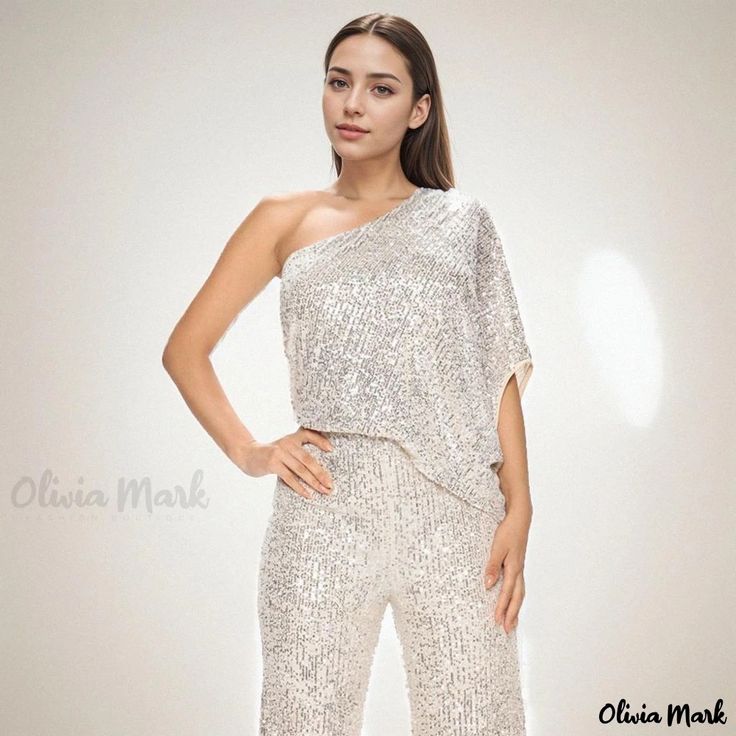 Olivia Mark - Sleeveless One-Shoulder Jumpsuit with Shimmering Sequins Embellishment Sequin Strapless Sleeveless Jumpsuit For Party, Sequin Strapless Jumpsuit For Party, Glamorous Strapless Sleeveless Jumpsuit For Party Season, Sequined Strapless Jumpsuit For Party Season, Party Season Sequined Strapless Jumpsuit, Chic Sleeveless Sequined Jumpsuit, Glamorous One-shoulder Jumpsuit For Party Season, Glamorous One-shoulder Jumpsuits And Rompers For Party, Glamorous Off-shoulder Jumpsuits And Rompers For Party