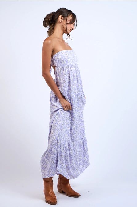 Get ready to make a playful statement with this Tie Back Floral Maxi Dress! The dainty floral print adds a touch of whimsy, while the lightweight fabric keeps you cool and comfortable. And who can resist the fun of a tie open back? Perfect for any occasion, this maxi dress will have you feeling effortlessly chic. Color: Purple Style #: SM-D20609M Fabric: 100% Rayon Spring Flowy Tie Back Beach Dress, Floral Print Maxi Sundress For Day Out, Maxi Sundress With Floral Print For Day Out, Spring Rayon Dresses With Tie Back, Feminine Tie-back Dress For The Beach, Spring Tie-back Maxi Beach Dress, Breezy Floral Print Maxi Beach Dress, Spring Breezy Beach Dress With Tie Back, Chic Ditsy Floral Maxi Dress For Day Out