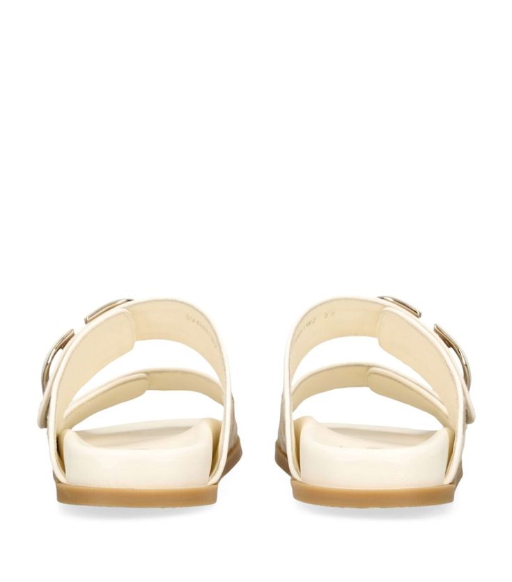 Find VALENTINO Raffia Vlogo Slides on Editorialist. These slides from Valentino Garavani combine cushioned leather insoles with upper straps adorned in the Italian Houses distinctive logo. Let their easy elegance complement your off-duty vacation looks or pare back a glamorous evening ensemble. Finished with a signature 'V', therell be no doubt as to where your brand allegiances lie. White Calf Leather Sandals With Buckle Closure, Designer Patent Leather Flat Sandals, Designer Patent Leather Sandals With Buckle Closure, Flat Patent Leather Sandals With Removable Insole, Luxury Sandals With Double Strap And Branded Insole, Luxury Flat Sandals With Buckle Closure, Luxury Sandals With Cushioned Footbed, Luxury Synthetic Sandals With Cushioned Footbed, Designer Patent Leather Sandals With Flat Heel