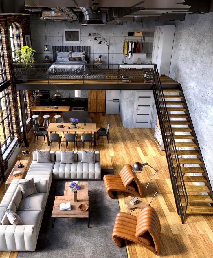 an aerial view of a living room with couches, tables and stairs leading up to the loft