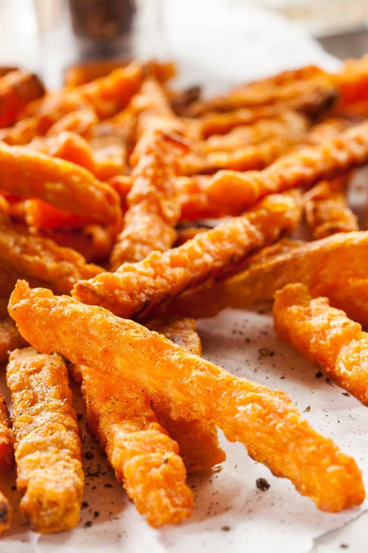 some fried food sitting on top of a white plate