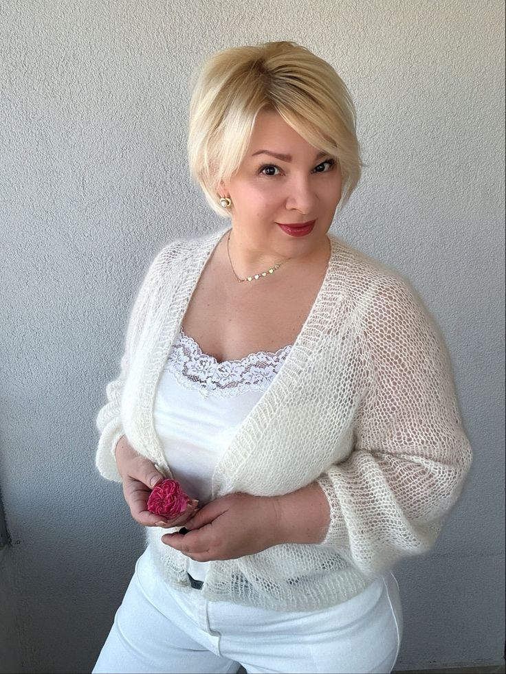 Add a touch of elegance and sophistication to your bridal ensemble with our  Ivory Mohair Jacket. This versatile piece can be worn in multiple ways - as a Women's Bridal Wrap, Wedding Cardigan, Mohair Cape, or Bridal Cover up. Made with high-quality mohair and wool, this Ivory  Cardigan is perfect for adding a pop of color to your outfit while keeping you warm and stylish on your special day. Whether you're looking for a IvoryWool Jacket for a wedding or a chic layering piece for a cool evening, Elegant Off White Winter Cardigan, Elegant Fitted Cardigan For Weddings, White Formal Cardigan For Winter, White Formal Winter Cardigan, Elegant Off White Long Sleeve Cardigan, Elegant Cream Cardigan For Wedding, Elegant Winter Wedding Cardigan, White Elegant Formal Cardigan, Elegant Cream Cardigan For Formal Occasions