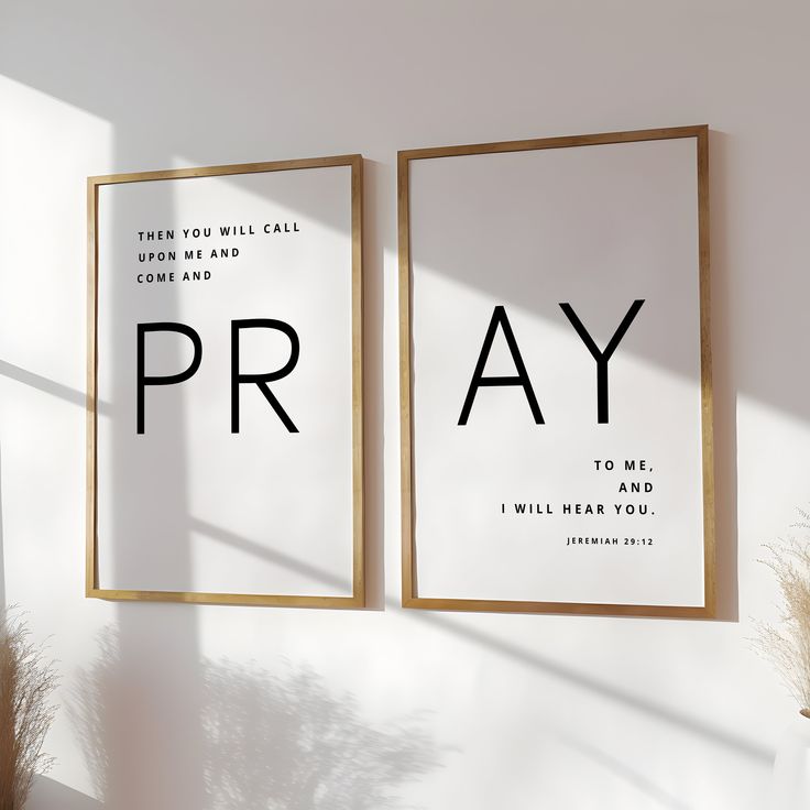 two framed posters with the words pray on them