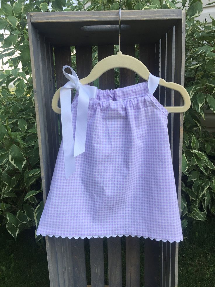 Perfect for those warm summer days.  This sundress is made of pre-washed, high quality, light weight 100% cotton.  The armholes have been finished with matching seam binding.  All other seams are finished.  Remove ribbon prior to washing.  Machine wash and dry.  Iron as needed. Spring Gingham Cotton Sundress, Lavender Cotton Dress For Garden Party, White Cotton Sundress For Picnic, Cute Cotton Sundress For Daywear, Summer Cotton Sundress In Purple, Purple Cotton Summer Sundress, Summer Purple Cotton Sundress, Cute Seersucker Summer Dresses, Summer Cotton Sundress For Picnic