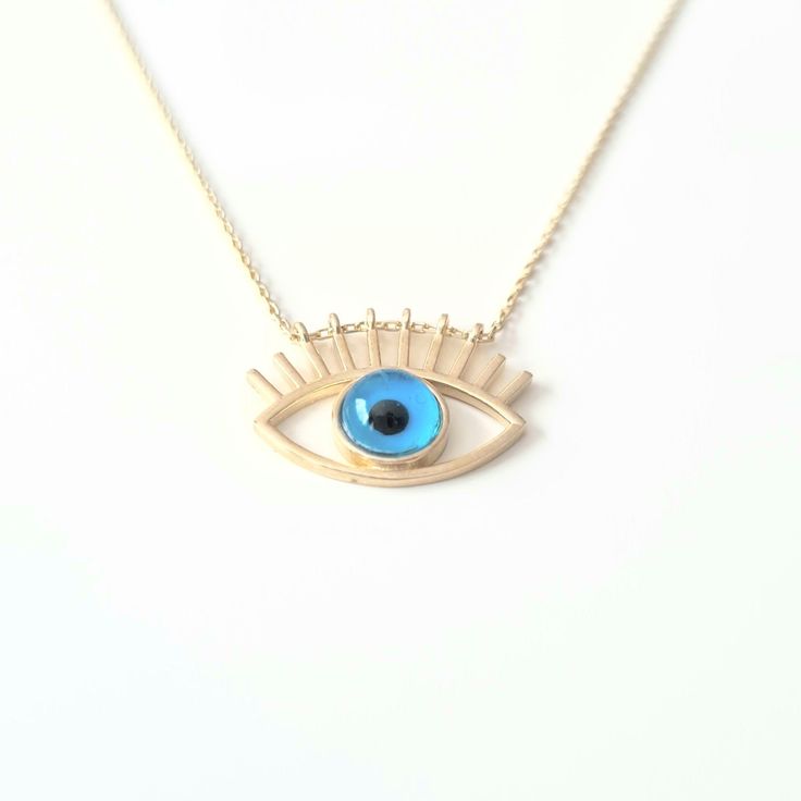 - Eye Evil Eyelash Pendant Necklace is made with high quality 14K real solid yellow gold. - Eye Evil Eyelash Pendant Necklace for women is decoreted with blue evil eye Stone. Evil Eyes are also called Turkish Greek Evil Eye, Faith Protection and Nazar. - This cute, charm, dainty, delicate, elegant women jewelry Eye Evil Eyelash Pendant Necklace has been artfully designed for timeless yet modern millennial fashion. - You receive the necklace in a beautiful and free gift box - Free shipping (Arriv Blue Pendant Necklace In 14k Gold, Blue 14k Gold Pendant Necklace, 14k Gold Evil Eye Jewelry Gift, Blue Fine Jewelry For Gifts, Blue Sterling Silver Jewelry For Celebration, Fine Blue Jewelry For Gifts, Celebration Blue Sterling Silver Jewelry, Spiritual Jewelry For Hanukkah Gift, Handmade 14k Gold Blue Jewelry