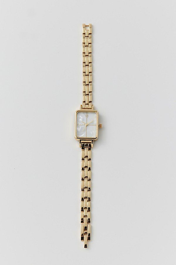 Classic metal rectangle watch. Essential watch style with a linked chain in polished metal complete with a rectangle style face. Features Classic metal rectangle watch Linked banded watch with rectangle face Content + Care Mixed metal, glass Avoid contact with water Imported Size Strap length: 7.24" l Case: .98" x .78" | Classic Metal Rectangle Watch in Gold, Women's at Urban Outfitters Rectangle Womens Watch, Womans Gold Watch, Cute Last Minute Birthday Gifts, Gold Square Watches Women, Womens Gold Watch Outfit, Gold Watch Small, Small Dainty Watch, Small Dainty Gold Watch, Dainty Wrist Watch