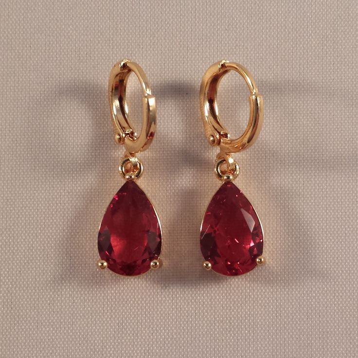 These Beautiful Red Crystal Earrings Are 18k Yellow Gold Filled, With (Lab-Created) Pear Shape Crystal Stones. Hoop Pierced Clasps. Brand New, Never Been Worn. These Fine Quality Earrings Are Perfect And Comfortable For Any Occasion Or A Special Gift. Get An $18 Gift Of Your Choice In My Listings With Purchase Of Two Or More Items. Please Send Offers And Questions. Stone: 8 X 11mm Or .31" X .43" Earrings: 26 X 8mm Or 1.02" X .43" Hoop Dia: .47"' Weight: 3.6g Red Pear-shaped Earrings For Gift, Elegant Red Hoop Earrings For Formal Occasions, Red Teardrop Hoop Earrings, Red Teardrop Hoop Earrings For Pierced Ears, Red And Gold Earrings, Pear Shape Earrings, Maximalist Jewelry, Pear Earrings, Fun Jewelry