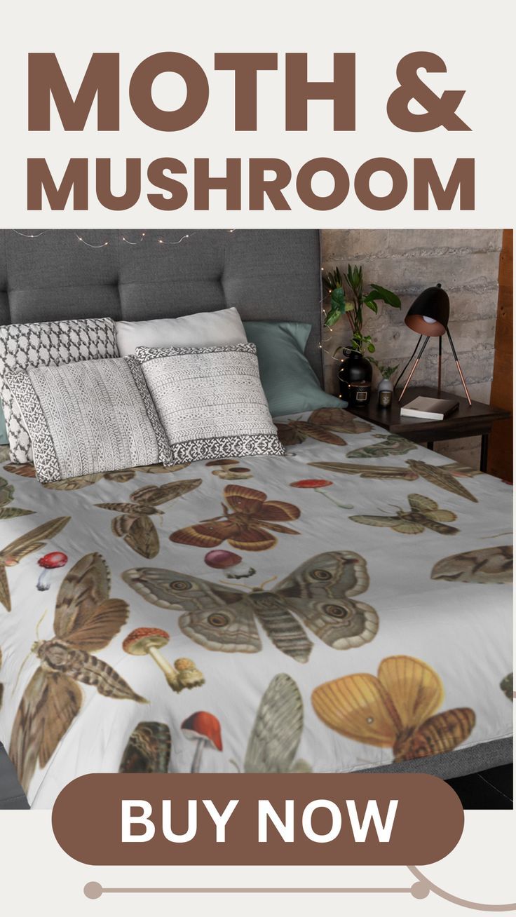 a bed with butterflies on it and the words moth & mushroom written in large letters