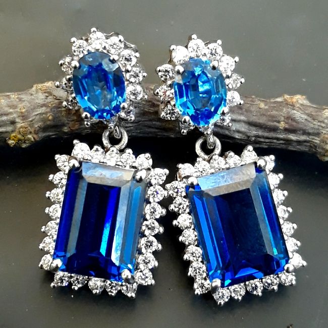 Be The Star Of The Party With These Stunningly Gorgeous Dark Blue Swiss Topaz And Sapphire Sterling Silver Earrings. Main Stone Is 18.40 Ct. 35mm Approx Length. #Uniquegifts #Giftsforher #Beautifuljewelry #Finejewelry #Statementearrings *Statement-Earrings-194* Fine Jewelry Sapphire Earrings For Party, Blue Gemstone Evening Earrings, Blue Gemstone Earrings For Evening, Sapphire Gemstone Earrings For Party, Party Sapphire Gemstone Earrings, Blue Gemstone Accented Earrings For Formal Events, Blue Gemstone Earrings For Formal Occasions, Blue Gemstone Accented Earrings For Formal Occasions, Formal Blue Earrings With Gemstone Accents