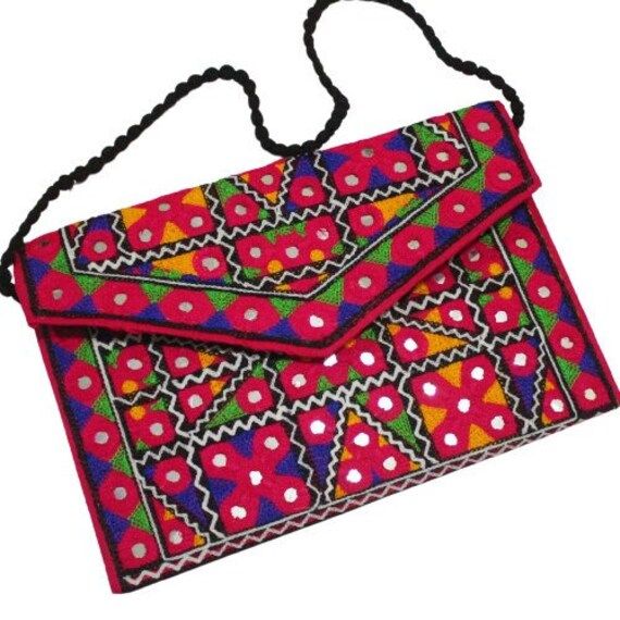 Multi-Color Embroidered Flower Design. 1 Zipper Compartment with External Multi-Color Embroidered Flower design. Easy to wear on your shoulder. Stylish and elegant Traditional Sindhi Shoulder bag and Clutch. Good idea for Gifts, Birthdays and Wedding etc. High- Quality Sindhi Shoulder Bag of Size: 30×19 2.55 cm. Traditional Summer Clutch Bag, Pink Rectangular Shoulder Bag For Festivals, Festive Multicolor Embroidered Rectangular Shoulder Bag, Festive Pink Embroidered Shoulder Bag, Multicolor Embroidered Rectangular Shoulder Bag For Summer, Embroidered Rectangular Shoulder Bag, Rectangular Shoulder Bag With Multicolor Embroidery For Summer, Summer Rectangular Shoulder Bag With Multicolor Embroidery, Summer Multicolor Embroidered Rectangular Shoulder Bag