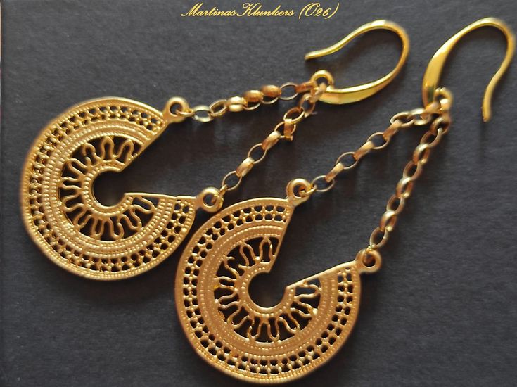 Ethno earrings with ear hooks and filigree, round mandala-pendants made of jewelry alloy. The chain parts consist of 925 sterling silver gold-plated.  Total length approx. 7 cm Pendant size 40 x 34 mm. Elegant Medallion Jewelry For Festivals, Elegant Festival Medallion Jewelry, Bohemian Gold Pendant Earrings, Bohemian Gold Round Danglers, Gold Bohemian Round Danglers, Antique Gold Filigree Metal Earrings, Bohemian Yellow Gold Filigree Earrings, Festival Brass Filigree Earrings, Gold Filigree Bohemian Chandelier Earrings