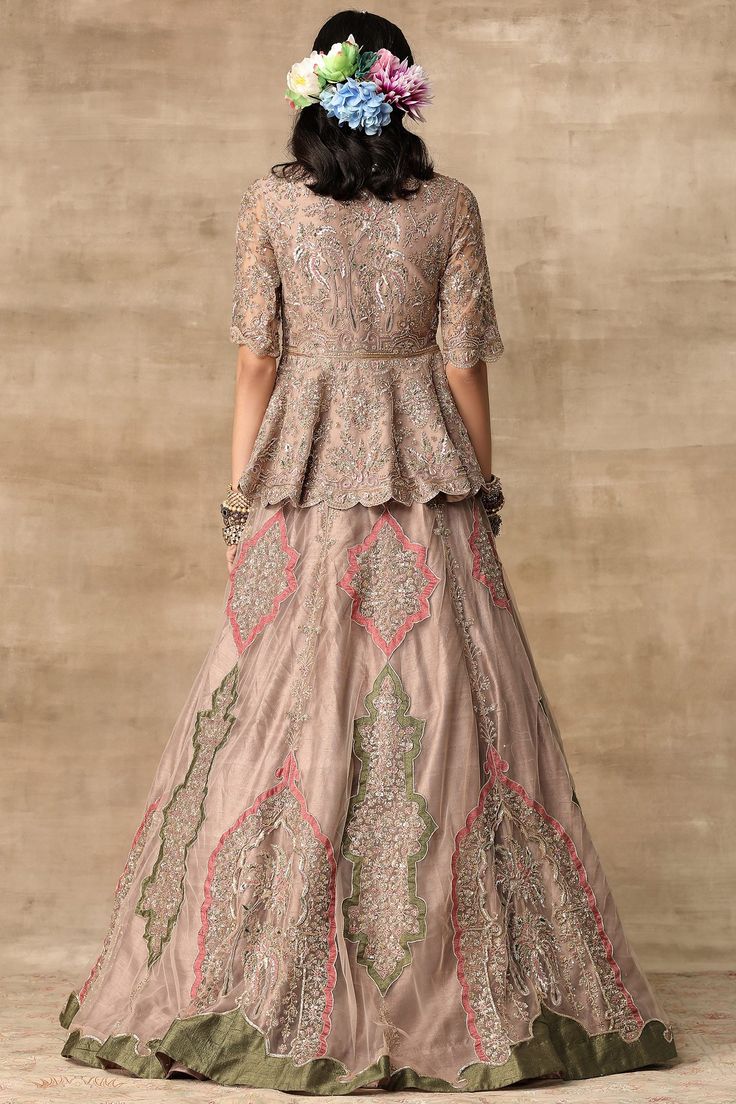 Champagne gold peplum blouse with all-over floral motif work and scallop border. Comes with embellished lehenga and dupatta.
Components:3
Embroidered
Neckline:V Neck
Sleeve Length:Half
Fabric:Net
Color:Gold
Peplum blouse
Scallop border
Closure: Blouse: Front hook - Aza Fashions Lehenga Peplum, Peplum Lehenga, Ridhi Mehra, Lehenga Dupatta, Organza Lehenga, Organza Blouse, Organza Skirt, Embroidered Crop Tops, Net Lehenga