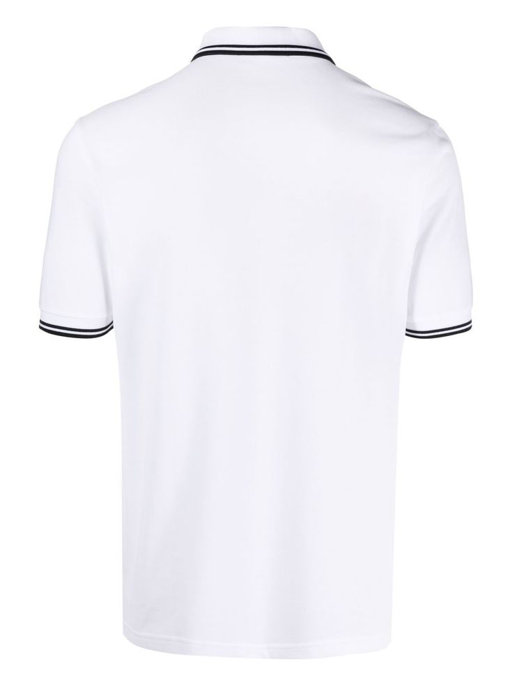 Twin Tipped polo shirt from FRED PERRY featuring white, BCI cotton, embroidered logo at the chest, striped tipping, polo collar, short sleeves and straight hem. Conscious: This item contains cotton from a brand that is committed to improving farming practices globally through the Better Cotton Initiative (BCI).. | Fred Perry Twin Tipped polo shirt Cotton Polo T-shirt With Contrast Collar, White Polo T-shirt With Striped Collar, Cotton Polo T-shirt With Embroidered Logo, Classic White T-shirt With Ribbed Collar, Collared Cotton T-shirt With Embroidered Logo, White Short Sleeve Polo Shirt With Ribbed Collar, Classic Polo T-shirt With Striped Collar, Classic White Polo Shirt With Ribbed Collar, White Cotton Polo Shirt With Striped Collar