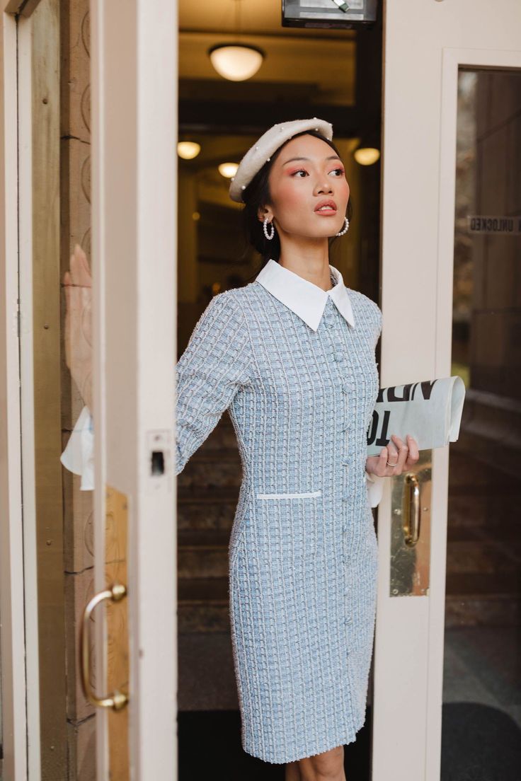 Elevate your wardrobe with the Blair Dress. Cinderella blue with white and black tweed fabric is complemented by shimmer detailing. A high neckline with a classy white collar and long sleeves create a sophisticated look. Functional buttons and pockets, along with a knee-length pencil skirt and hidden back zipper make this dress both stylish and practical. Lined throughout for added comfort. Available in sizes XXS, XS, S, M, L, XL, 1X, 2X, 3X, 4X, + 5X!! blue dress, textured dress, button dress Long Sleeve Tweed Mini Dress For Work, Fitted Mini Length Tweed Dress For Office, Long Sleeve Tweed Work Dresses, Chic Knee-length Tweed Dress For Office, Knee-length Tweed Dress With Button Closure, Formal Long Sleeve Tweed Dress With Button Closure, Tweed Mini Dress For Work Knee-length, Knee-length Tweed Mini Dress For Work, Fitted Knee-length Tweed Dress For Winter