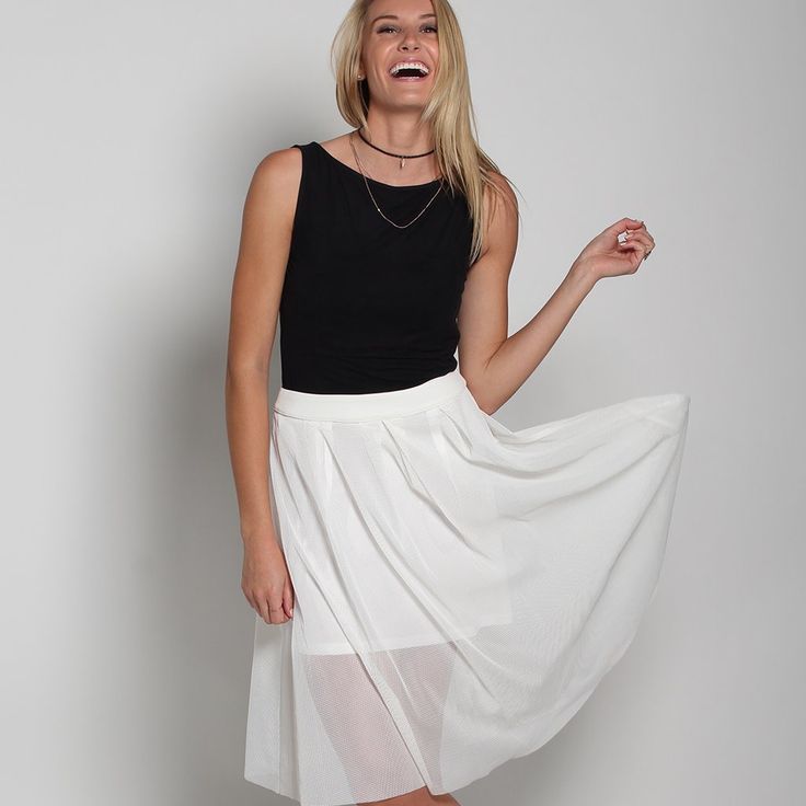 High-Waisted Midi Skirt. Mesh Fabric. Back Zip Closure. Model Is 5'9" / 175 Cm., Wears A S. Content: 100% Polyester; Lining: 100% Polyester Care: Dry Clean Skirt Length: 26" / 66 Cm. White Pleated Skirt For Summer Party, White Stretch Skirt For Day Out, White Pleated Skirt For Spring Party, White Flowy Pleated Skirt For Party, White Gathered Maxi Skirt For Day Out, Chic White Flowy Skirt, White Stretch Gathered Skirt, White Pleated Mini Skirt For Summer, White Mini Pleated Skirt For Summer