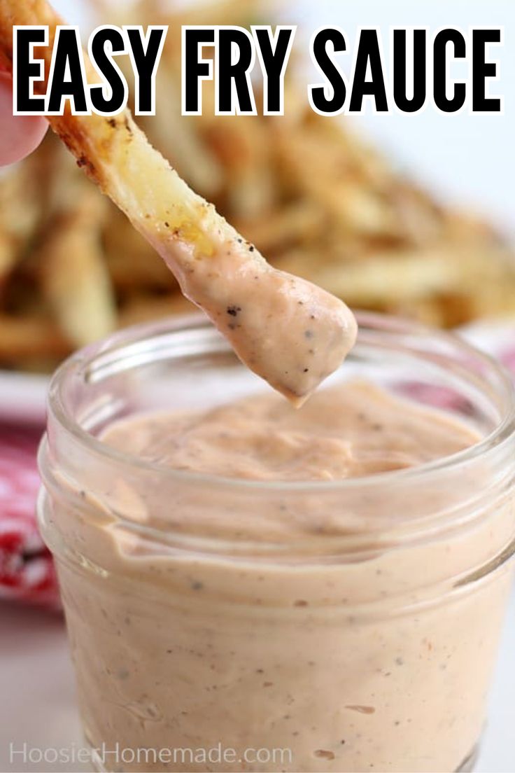 an easy fry sauce in a glass jar with a wooden stick sticking out of it