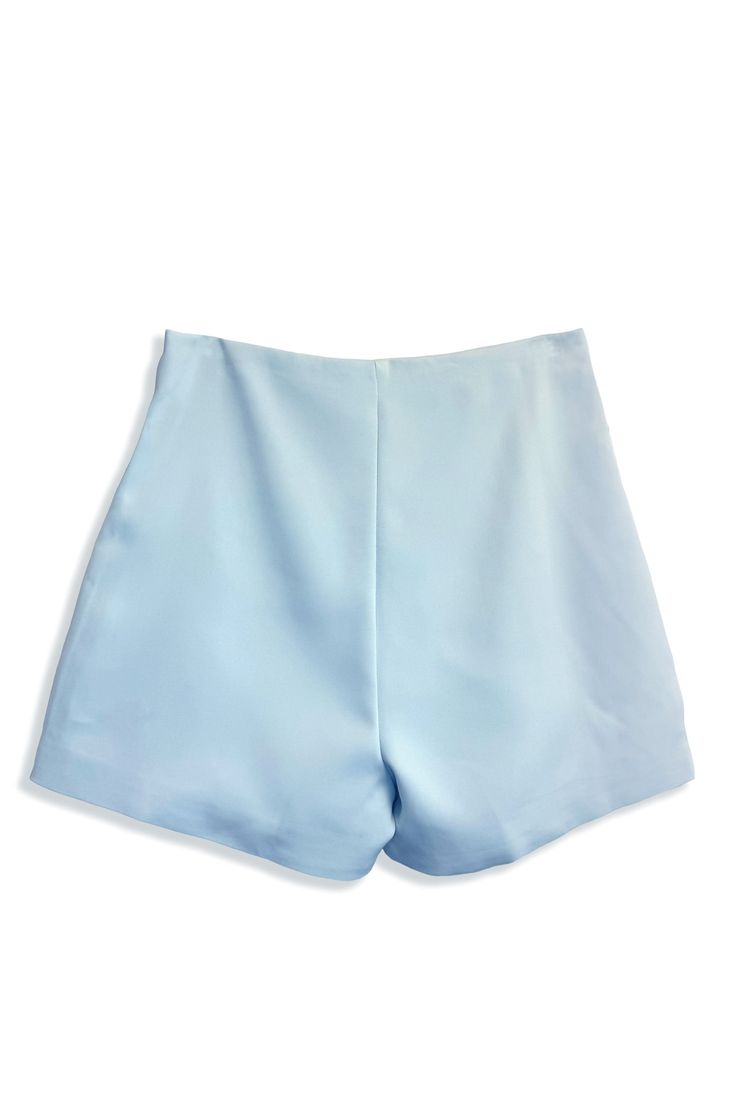 The Icy Blue hue of these shorts creates a cooly sophisticated pallette that can take you from lunch at the beachside, shopping downtown and onto dinner and drinks. Pairs perfectly with the matching One Shoulder Icy Blue Top. Two mother-of-pearl buttons accent the waist and hips. XS-XL SSW24083 Bermuda Bottoms With Built-in Shorts For Poolside, Solid Color Short Beach Season Bottoms, Solid Short Bottoms For Beach Season, Solid Color Short Length Bottoms For Beach Season, Solid Short Length Bottoms For Beach Season, Beachwear Skort With Built-in Shorts, Summer Skort With Built-in Shorts For Poolside, High Waist Blue Bermuda Shorts With Built-in Shorts, Light Blue Bottoms For Poolside And Beach Season