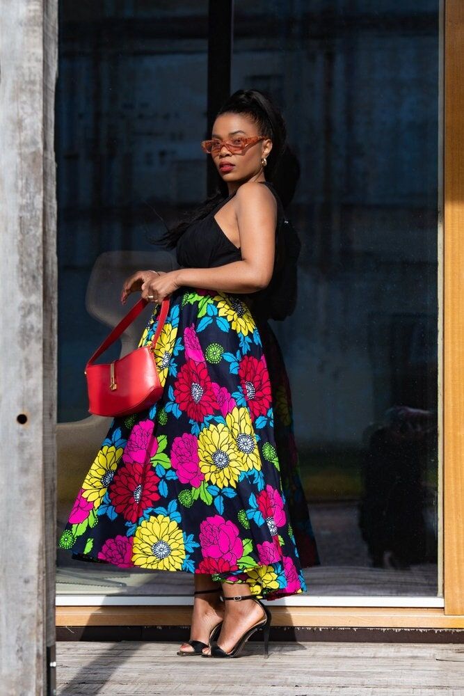 "A splash of colour represents vibrancy, aliveness, and all things beautiful! The Petra floral skirt is not just an everyday piece, this one is a timeless \"feel good\" piece that you can wear at your bestie's wedding, also suitable for brunch dates with family and friends, but we also love that you can pass this skirt from generation to generation because of it's classic and ageless look. Here is to forever with Petra! Unlined Two side pockets  Skirt overall length is 35 inches. Elastic waist b Vibrant Floral Print Summer Skirt, Vibrant Print Skirt For Summer, Vibrant Print Summer Skirt, Multicolor Floral Print Long Skirt, Multicolor Floral Print Skirt For Spring, Spring Multicolor Floral Print Skirt, Vibrant Multicolor Spring Skirt, Multicolor Floral Print Maxi Skirt For Day Out, Colorful Vibrant Skirt For Spring