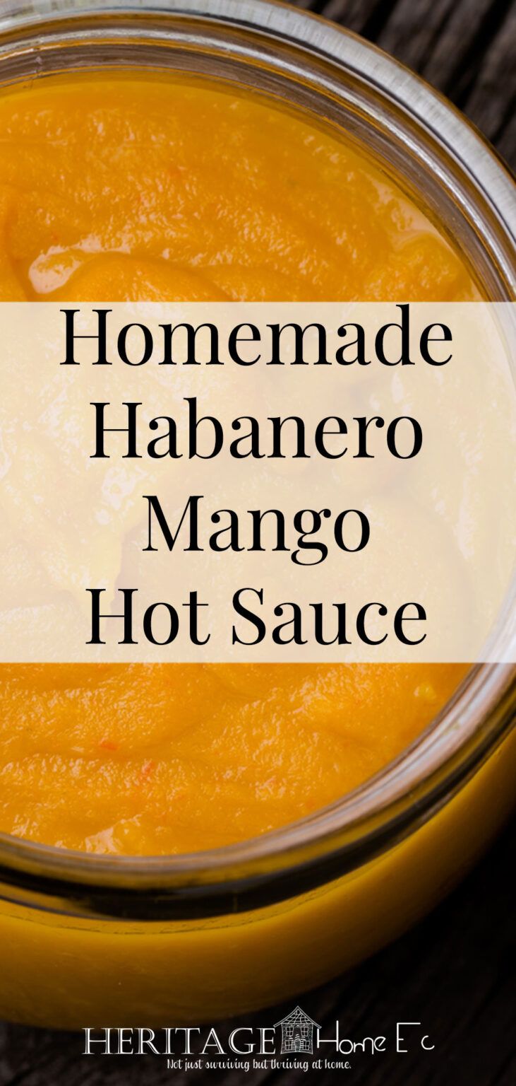 homemade habanero mango hot sauce in a glass bowl with text overlay that reads homemade habanero mango hot sauce