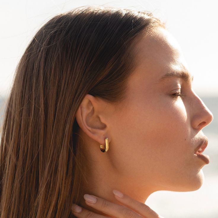 The most perfect pair of oval hoops you'll ever own. We mean it when we say, these earrings are made for everyday wear. Shower, exercise and wear to bed while looking stylish. - 14k gold-filled, made in the US- Inner diameter: - Height: 16mm, Width: 13.5mm- Waterproof, tarnish resistant & hypoallergenic Everyday 14k Gold Filled Huggie Earrings, Minimalist Oval Everyday Earrings, Yellow Gold Oblong Hoop Earrings For Everyday, Everyday Yellow Gold Oblong Hoop Earrings, Yellow Gold Everyday Hoop Earrings, Oval Hoop Earrings For Everyday, Everyday Oval Hoop Earrings For Pierced Ears, Dainty Oval Earrings For Everyday, Everyday Oval Hoop Earrings