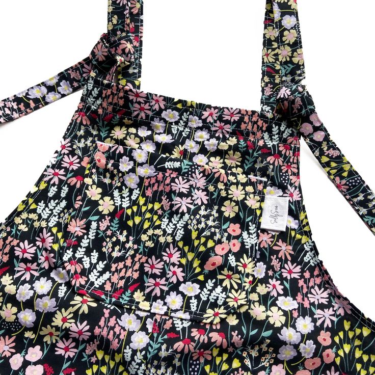 🌸❤️🧵 HANDMADE FLORAL DUNGAS! 🧵❤️🌸  These relaxed fit dungarees are made from poly cotton fabric, are fully lined and have adjustable tie fastenings at the top.  Long dungarees come with 5 pockets - 1 bib and 2 side pockets on the front and 2 side pockets on the back.  Short dungarees come with 3 pockets - 1 bib pocket on the front and 2 side pockets on the back.  Dungaree dress come with 3 pockets - 1 bib pocket and 2 side pockets on the front. If you would prefer different pocket placement Cotton Shortalls With Adjustable Straps And Relaxed Fit, Cotton Relaxed Fit Shortalls With Adjustable Straps, Cotton Bib Front Shortalls With Suspenders, Cotton Bib Front Overalls With Suspenders, Cotton Shortalls With Suspenders And Bib Front, Cotton Overalls With Suspenders And Bib Front, Spring Bib Front Overalls With Adjustable Straps, Black Cotton Jumpsuits And Rompers With Adjustable Straps, Casual Cotton Overalls With Tie Straps