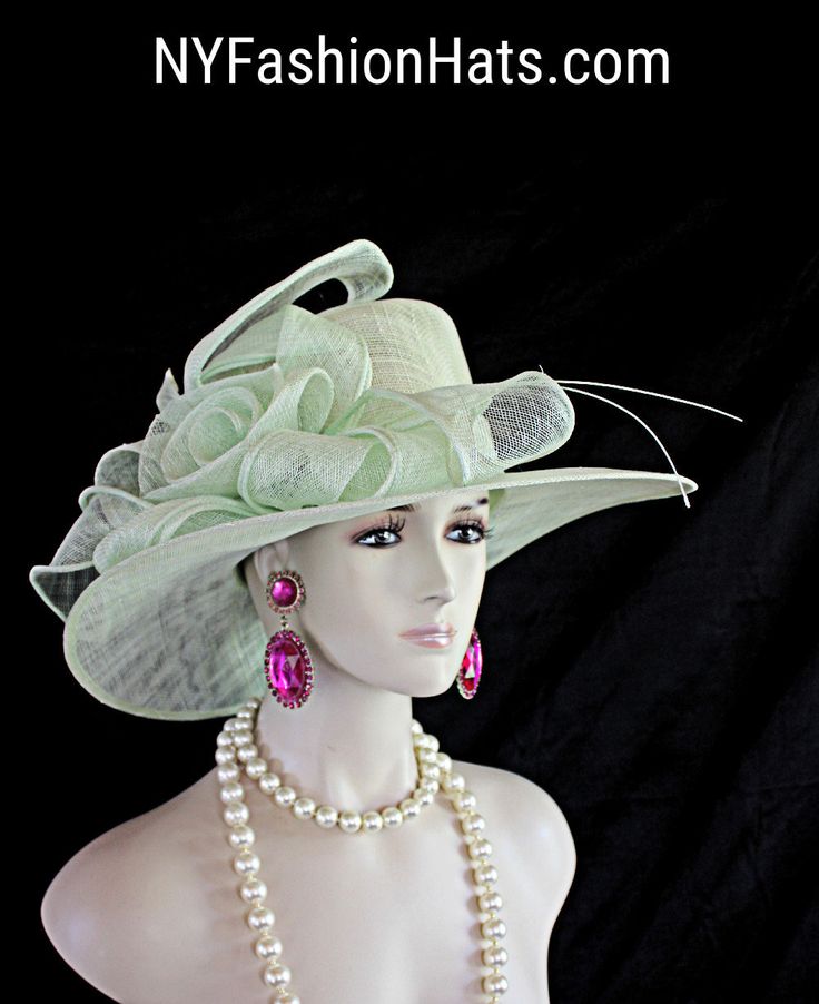 Women's Mint Green Sinamay Straw Large Abstract Brim Couture Designer Hat. This Beautiful Hat Is Embellished With A Decorative Large Sinamay Straw Bow. This Formal Statement Hat Wedding Headpiece Can Be Worn In Different Positions. This Elegant Soft Pastel Colored Hat Will Make A Fashion Statement. This ladies bespoke couture formal designer wedding fascinator hat is appropriate to wear for horse races, The Kentucky Derby, The Dubai World Cup, The Royal Ascot, The Melbourne Cup, Belmont Stakes, Fitted Costume Hat For Spring Weddings, Fitted Spring Wedding Costume Hat, Brimmed Wedding Hats For Summer, Fitted Costume Hats And Headpieces For Spring Weddings, Fitted Wedding Hat For Spring, Wide Brim Summer Wedding Headpiece, Summer Wedding Wide Brim Headpiece, Fitted Brimmed Mini Hat For Wedding, Fitted Wide Brim Mini Hat For Weddings