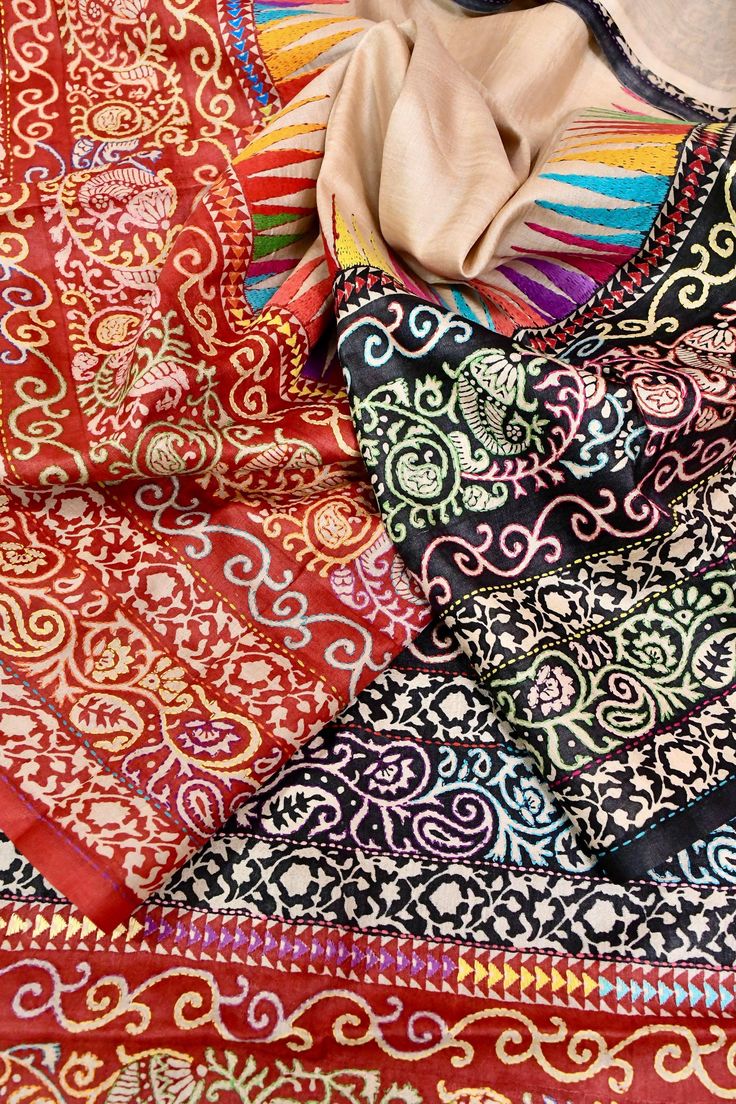 The latest collection with delicate & traditional hand Kantha embroidery on the body that comes with hand batik work amazing style tussar making this saree one of the magnetic works in sandal color. With an added elegance is its Ganga Jamuna border. Color: A shade of sandal color Technique: Amazing work of hand kantha embroidery with hand block and a Ganga Jamuna border Fabric: Tussar Quality: Indyvogue's Assurance of Pure Silk Mark Certified Saree Bohemian Batik Print Saree, Traditional Batik Print Wear For Festivals, Bohemian Traditional Wear With Batik Print For Festivals, Bohemian Batik Print Traditional Wear For Festivals, Traditional Festival Wear With Batik Print, Multicolor Block Print Traditional Wear For Eid, Bohemian Tussar Silk Saree With Batik Print, Multicolor Bohemian Dupatta With Intricate Embroidery, Bohemian Multicolor Embroidered Dupatta