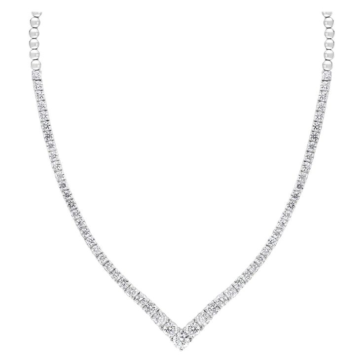 A simple yet very brilliant piece showcasing round diamonds that elegantly graduate larger as it reaches the center of the necklace. 85 Diamonds weigh 5.05 carats total and are very fine quality Made in 14k White Gold. 17 inches in length. Box Clasp with double lock mechanism. All diamonds are GH color SI1 Clarity. Available in Yellow and Rose Gold. Style available in different price ranges. Prices are based on your selection. Please contact us for more information. Classic Diamond Necklace For Formal Occasions, Formal Diamond Necklaces With Tension Setting, Classic Diamond Necklaces For Formal Occasions, Classic Formal Necklaces With Single Cut Diamonds, Classic Formal Diamond Necklaces, Classic Round Cut Diamond Necklace With Tension Setting, Elegant Diamond White Necklaces With Tension Setting, Elegant Solitaire Necklace With Tension Setting For Formal Occasion, Elegant Formal Solitaire Necklace With Tension Setting