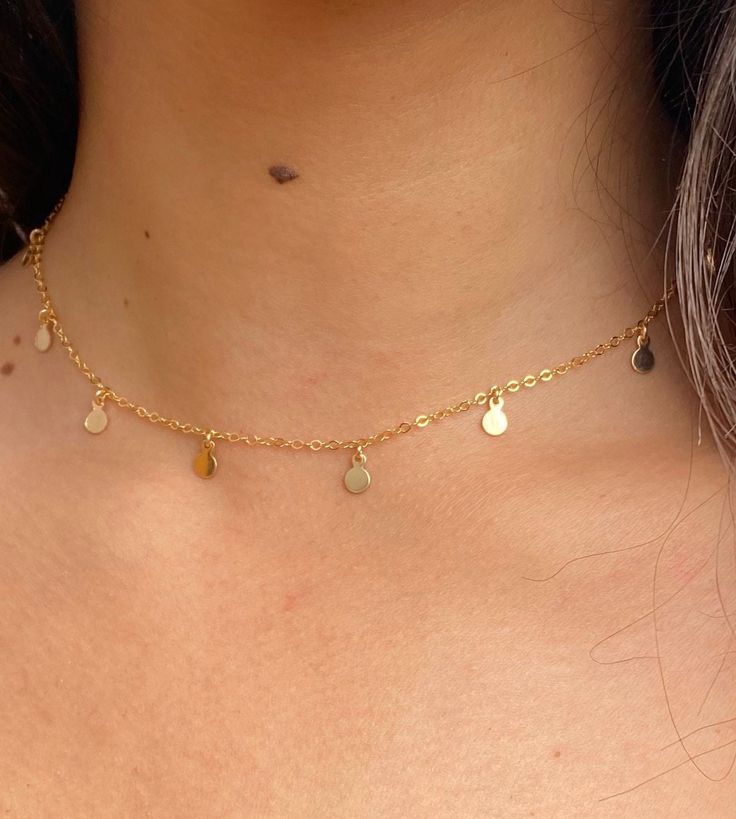 Circle charm choker  ✦ Details ✦ ✧ This necklace can be worn from 14-16 inches long. The chain is 14 inches long with a 2 inch extender. ✧ This necklace is available in sterling silver or gold filled. ✧ The circle charms are 4.25mm in diameter. ✦ ABOUT GOLD FILLED ✦ ✧ Gold filled is an actual layer of gold-pressure bonded to another metal. ✧ Gold filled does not flake off, rub off or turn colors. ✧ Most people with jewelry sensitivities can wear gold filled without worries of any allergic reacti Adjustable Delicate Chain Charm Choker, Adjustable Delicate Chain Choker Charm Necklaces, Sterling Silver Charm Choker With Adjustable Chain, Sterling Silver Adjustable Choker Charm Necklace, Minimalist 14k Gold Filled Choker, Delicate Adjustable Choker Charm Necklaces, Sterling Silver Choker With Adjustable Chain, Simple Choker Necklace With Adjustable Chain, Minimalist Sterling Silver Choker With Delicate Chain