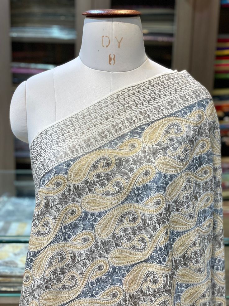 Kashmir is known for its craftsmanship. From carpets to shawls and scarves every single product made in Kashmir is made by diligent craftsmen who work round the clock to make a very fine quality product. This shawl is made of 100% Pure Cashmere Wool and its embroidered fully with neutral colour to give it a classical look. Its embroidered by traditional Kashmiri style of Aari embroidery The embroidery done on this is a traditional Kashmiri Embroidery known as ''Aari Work''. It has a combination Kalamkari Shawls, Kashmiri Embroidery, Shawl Wedding, Kashmiri Shawls, Abstract Embroidery, Cashmere Pashmina, Aari Embroidery, Cashmere Wrap, Cashmere Shawl