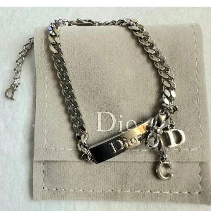 As A Proud Owner Of This Christian Dior Silver Chain Link Bracelet, You'll Not Only Be Showcasing Your Impeccable Taste But Also Your Devotion To Timeless Fashion. Signes Of Wear - Minor Scratches, Minimum Discoloration Length - 8” Pre-Owned No Long Wait Time **Fast Shipping 24 Hours Process Authenticity Guaranteed - Discount On Multiple Items Jewelry Luxury Designer Handbags And Wallets Louis Vuitton Chanel Bottega Veneta Cartier Chloe See By Chloe Coach Michael Kors Brahmin Gucci Patricia Nash Burberry Prada Saint Laurent Celine Dior Fendi Givenchy Marc Jacobs Tory Burch Ralph Lauren Longchamp Versace Women Clothing Dresses Tops Pants Jeans Men Clothing Shirts T-Shirts Pants Jeans Shoe Luxury Silver Chain Link Bracelet, Dior Chain Bracelet, Dior Bracelet Silver, Versace Women Clothing, Dior Silver Necklace, Dior Wallet On Chain, Versace Women, Dior Jewelry, Luxury Designer Handbags