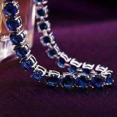 A classic tennis bracelet with a colorful surprise. 28 of the highest quality Sapphire Blue Swiss CZ diamonds in a solitaire pattern. The setting is triple platinum clad (highest quality platinum plating) and each stone is prong-set for security. Snap hook closure for comfort and security. Flexible for comfort--can be worn all day! Swiss CZs are known for their sparkling reflection of light with deep colors. Very versatile can be worn every day or for a special occasion. Coordinates well with yo Sapphire Tennis Bracelet, Diamond Tennis Bracelet, Jewelry Blue, Bracelet Blue, Tennis Bracelet Diamond, Light Reflection, Deep Colors, Holiday Birthday, Cz Diamond