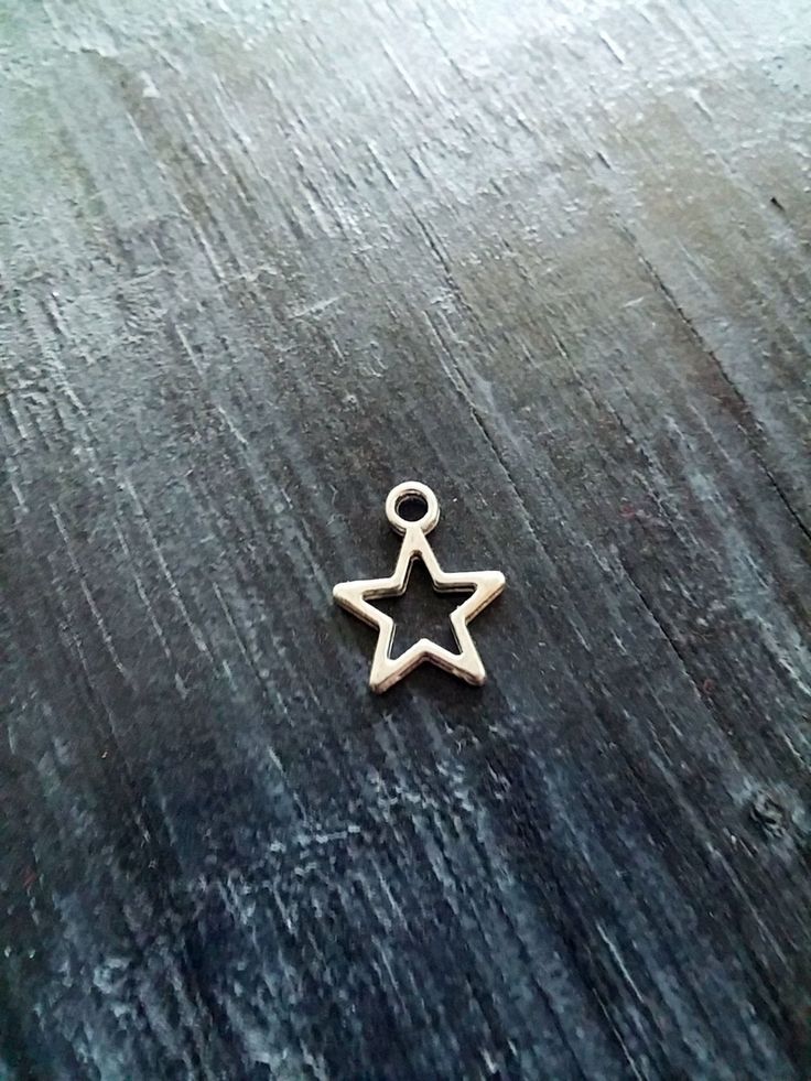 "10 small silver stars charms/pendants 3D design; the design is on both sides. 14mm (0.6\") x 11mm x 1.5mm thick Silver color metal alloy Please let me know if you have any questions!" Silver Sterling Silver Star Charms, Silver Star-shaped Sterling Silver Charms, Silver Star Sterling Silver Charms, Sterling Silver Star-shaped Charms, Silver Starfish Charm As Gift, Silver Starfish Charm For Gift, Silver Starfish Charm For Gifts, Metal Star Charm Necklace In Star Shape, Silver Star-shaped Charm Necklace