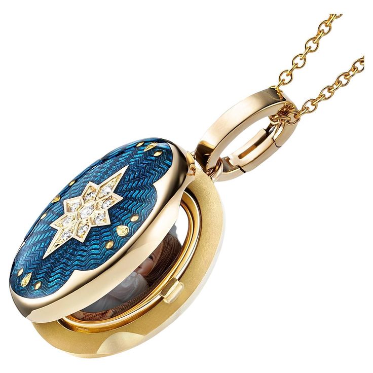 Victor Mayer oval pendant locket 18k yellow gold, Victoria Collection, peacock blue vitreous enamel, 9 diamonds, total 0.07 ct, G VS, brilliant cut, measurements app. 20.0 mm x 15.0 mm About the creator Victor Mayer Victor Mayer is internationally renowned for elegant timeless designs and unrivalled expertise in historic craftsmanship. Lovers of the extraordinary appreciate the beauty of Victor Mayer's designs, which use extremely rare techniques such as genuine enamel or elaborate engravings. S Pendant Locket, Blue Diamonds, Vitreous Enamel, Oval Locket, Anchor Chain, Luminous Colours, Oval Pendant, Peacock Blue, 00 00