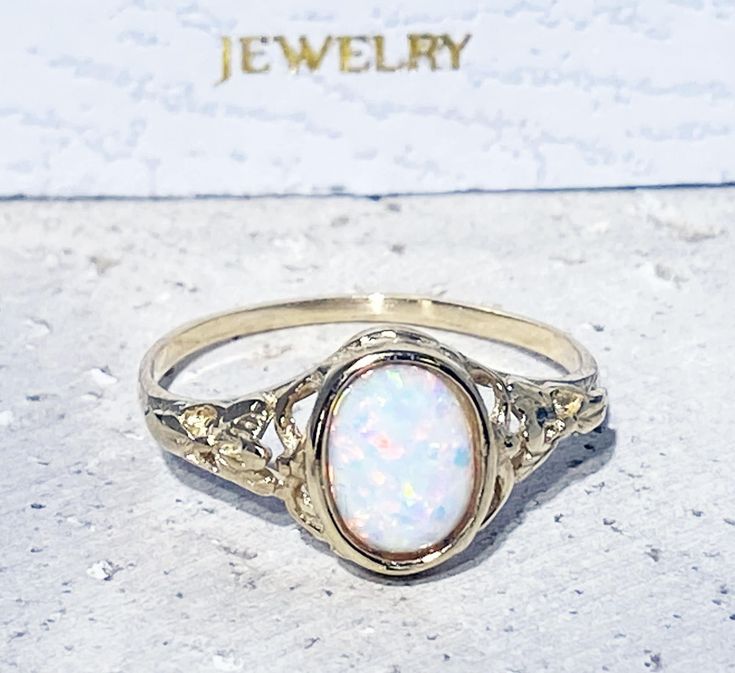 Don't miss this opportunity to own this beautiful gemstone ring crafted in 14k gold filled => Gemstone Type - Opal => Gemstone Size - 6*8 mm => Gemstone Cut - Cabochon => Gemstone Shape - Oval Shape => Metal Type - 14k Gold Filled (Tarnish Resistant And Nickel Free) - also available in 925 sterling silver * Please contact me for pricing on a sizes larger than 11 * ~ Feel free to ask me about custom made designs. ❏ Replacements and custom orders : ✪ 925 sterling silver - no additio Oval Opal Promise Ring, Dainty Oval Cabochon Ring, Adjustable Oval Opal Ring In 14k Gold, Adjustable 14k Gold Oval Opal Ring, Adjustable 14k Gold Opal Ring, White Oval Birthstone Ring For Gifts, Dainty White Oval Birthstone Ring, Adjustable Oval Opal Ring For Wedding, Oval Opal Birthstone Ring For Gift