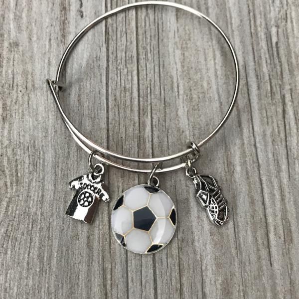 Handmade Soccer Bracelet, Custom Soccer Jewelry, Girls Soccer Bangle Bracelet- Soccer Charm Bracelet Perfect Soccer Gifts for Girls SOCCER JEWELRY- Soccer Charm Bracelet For Girls SOCCER BANGLE BRACELET -Silver Plated Soccer Shirt, Colorful Soccer Ball and Soccer Cleat Charms on bangle bracelet EXPANDABLE ~ Adjust to fit most wrists. The inner diameter is approximately 2.36"-2.56". It is fully adjustable to fit a 5 inch to 8.5 inch wrist. Will fit most kids, teens and adult wrists. SOCCER GIFT- Adjustable Alloy Bracelet For Friendship, Adjustable Alloy Friendship Bracelet, Friendship Metal Bangle Bracelet, White Adjustable Alloy Charm Bracelet, White Alloy Bangle Bracelet, Metal Bangle For Friendship, Adjustable Alloy Charm Bracelet, Silver Bangle Friendship Bracelets, Adjustable Alloy Bangle Bracelet