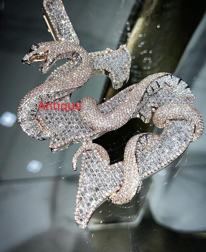 2.0 ct Diamond Dragon Pendant Iced Out Dragon Pendant Dragon Animal Pendant Dragon Faced Pendant Diamond Hip Hop Pendant Diamond Pendant ✥ O T H E R ∙ I N F O R M A T I O N ✥ ♦ Due to every item in our shop is made to order we are open for moderate customization on demand. Contact us prior to the order. ♦ Your item will be nicely packed to gift in elegant jewelry boxes. ♦ The jewelry Certificate will be sent separately if demanded prior to the order. Contact us for more details. ✥ T U R N ∙ A R O U N D ∙ T I M E ✥ ♦ Our turnaround time is about 6 days for the given design and finish or from 7 to 10 business days for custom-made designs. This can change during peak seasons. ✥ If you can't find the information you need or need some advice for your design, feel free to contact us. We are eage Luxury Snake-shaped Jewelry With Diamond Accents, Luxury White Gold Snake-shaped Jewelry, Luxury Silver Diamond Pendant Necklace, Luxury Iced Out Pendant Necklace, Luxury Diamond Jewelry With Bling, Snake-shaped Diamond Jewelry For Anniversary, Fine Jewelry Snake Shape With Diamond Accents, Diamond Snake Shape Jewelry For Anniversary, Fine Jewelry With Diamond Accents In Snake Shape