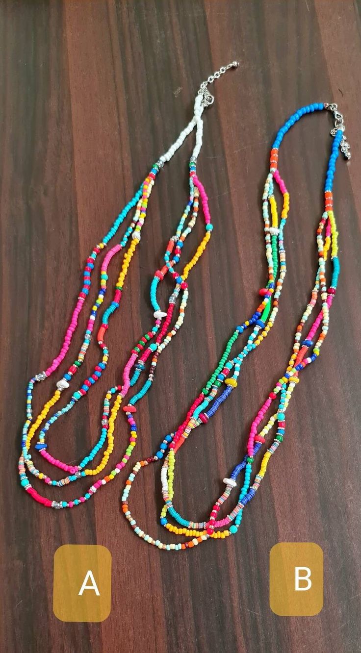 "Beautiful colorful vibrant multi beads multi-row summer necklace. This multi-layered multicolored necklace is made of mixed beads and seed beads. This Mexican multi-colored necklace is an ideal necklace for the Summer. The necklace is approx. 28\" long and has three rows. The drop length is approx. 13-14\". Available in two options: A and B * The products are handmade and shipped from India. * Package preparatiion time is 1 to 2 business days. * SHIPPING METHOD:  * Standard - It will take appro Summer Multi-strand Beaded Necklaces, Summer Multi-strand Colorful Beaded Necklaces, Multicolor Beads For Summer Jewelry Making, Multicolor Heishi Beads Jewelry With Colorful Beads, Multi-strand Beaded Necklaces For Summer, Bohemian Multicolor Beaded Layered Necklace, Colorful Beaded Chain Beads For Beach, Handmade Multicolor Beads For Summer, Colorful Beaded Chain For Beach