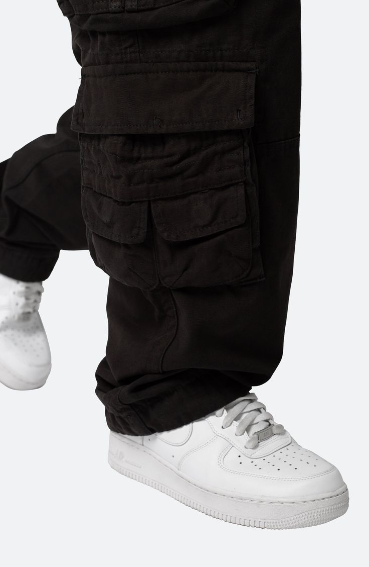 The relaxed fit of these all-cotton pants lets you move with ease all day long, while the multitude of cargo pockets keep all your essentials close at hand. 32" inseam; 9 1/2" leg opening; 11 3/4" front rise Zip fly with button closure; drawstring waist Front slant pockets; front zip pockets; cargo flap-patch pockets; back patch pockets 100% cotton Machine wash, tumble dry Imported Streetwear Washed Black Bottoms With Cargo Pockets, Combat Cotton Cargo Pants, Urban Style Cargo Pants With Multiple Pockets, Urban Cargo Pants With Multiple Pockets For Adventures, Combat Cotton Parachute Pants With Multiple Pockets, Baggy Combat Cotton Cargo Pants, Baggy Cotton Combat Cargo Pants, Urban Washed Black Pants With Side Pockets, Urban Cotton Cargo Pants For Outdoor