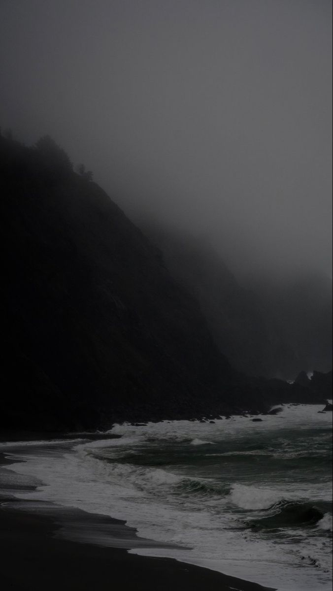 the beach is covered in fog and water