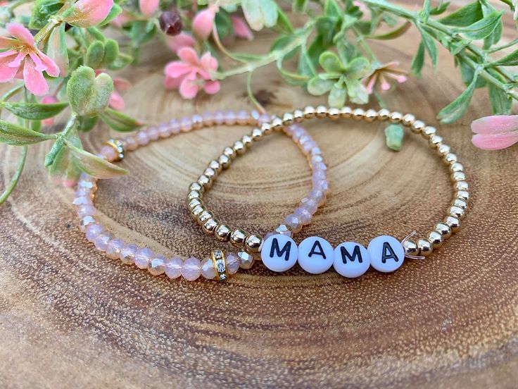 4mm bracelets. Comes with a nude/pink bracelet and a gold "mama" bracelet. Custom Name Pink Charm Bracelet For Mother's Day, Handmade Rose Gold Bracelets For Mother's Day, Custom Name Pink Jewelry For Everyday, Adjustable Pink Name Bracelet With 8mm Beads, Everyday Pink Custom Name Jewelry, Pink Letter Beads Bracelets As Gift For Mom, Personalized Pink Bracelets As Gift For Mom, Personalized Pink Bracelet As Gift For Mom, Personalized Pink Bracelet As A Gift For Mom