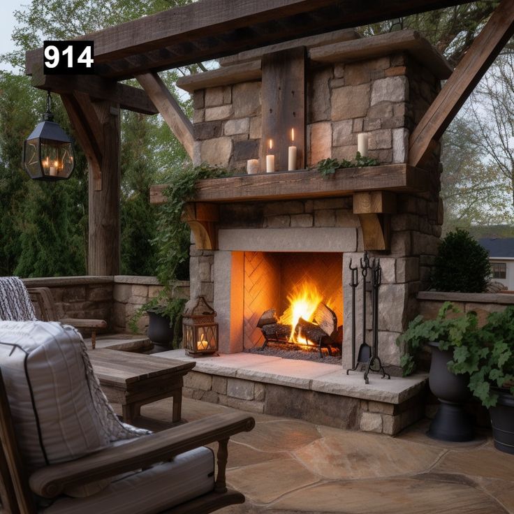 an outdoor fireplace with lit candles on it